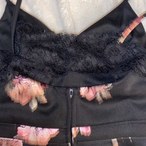 Black dress with pink flower from the brand speechless